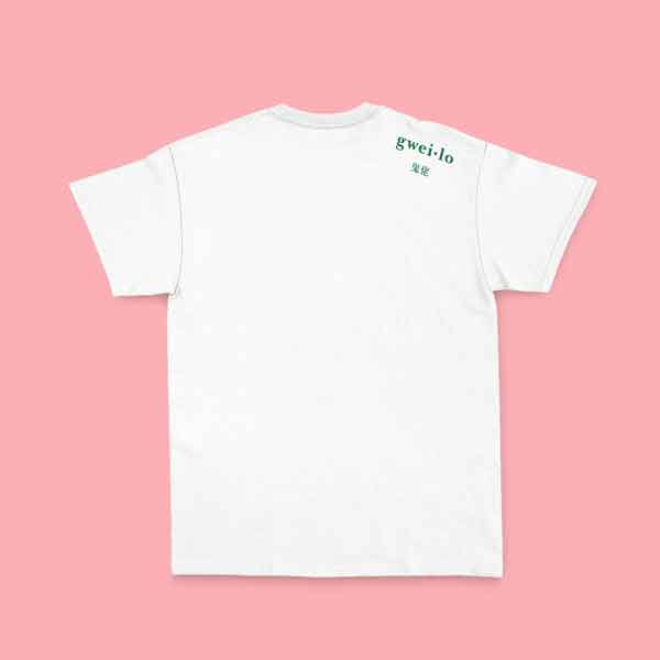 Back of a Gweilo Beer white I Hop HK t-shirt with a small green gweilo logo near the right shoulder. Pink pastel background.
